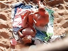 Beautiful blonde on her back for beach sex