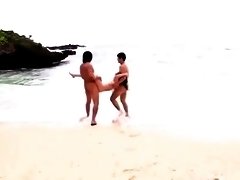Lustful Japanese wife enjoys a wild threesome on the beach