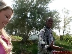 Young Brooke Scott takes black cock and cum in the back yard