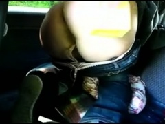 Curvy amateur brunette fists her hungry ass in the car