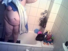 Big breasted amateur granny taking a shower on hidden cam
