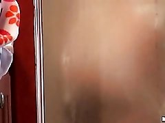 Bubble butt brunette filmed taking a shower