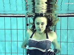 Underwater with a shaved pussy teen girl